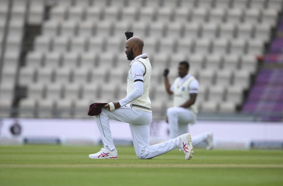 West Indies' Roston Chase takes a knee on the first day of the 1st cricket Test match between England and West Indies, at the Ageas Bowl in Southampton, England, Wednesday July 8, 2020. (Mike Hewitt/Pool via AP)