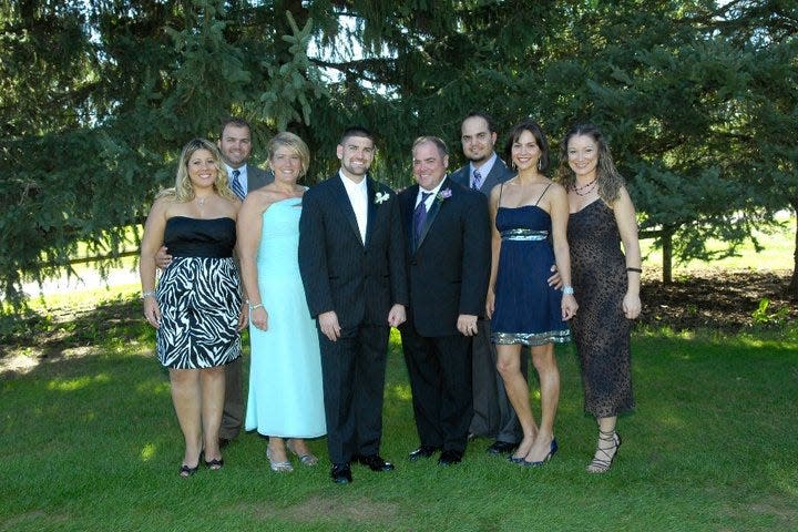 Bruce and Sue Goldsen's Brazilian family are pictured with them at their son David's wedding in 2010 at the Lenawee Country Club in Adrian. At far left is Adolfo, the first exchange student the Goldsens hosted in 1993 through Rotary Youth Exchange, with his wife, Fernanda. Next to Bruce, fourth from right, is brother Martinho, sister Lissandra and Martinho's wife Tatiane.  The Goldsens hosted both Adolfo and Lissandra in 1995. Sue Goldsen is third from left, and David Goldsen is fourth from left.