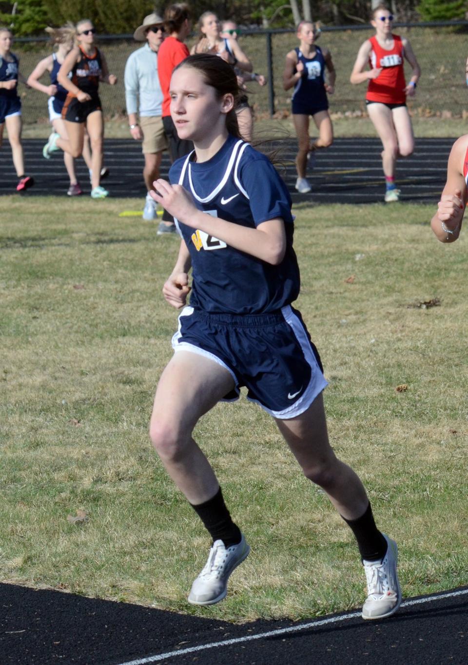 Katie Berkshire competes in the 1600-meter run during the Harbor Springs Ram Scram on Friday, April 14.