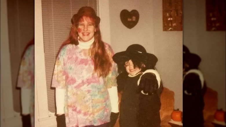 Author posing with sister on Halloween circa 1993