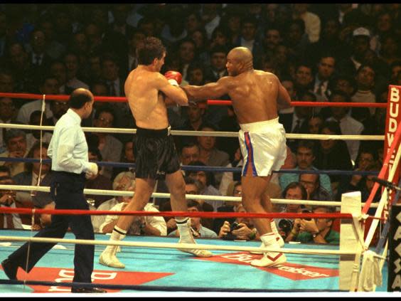 Gerry Cooney in action against George Foreman during their 1990 (Getty)