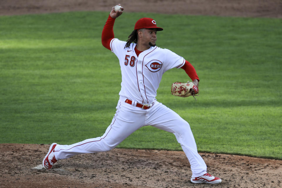 Cincinnati Reds' Luis Castillo (58) throws the ball for his 500th career strikeout against Detroit Tigers' Cameron Maybin in the sixth inning during a baseball game at Great American Ballpark in Cincinnati, Saturday, July 25, 2020. (AP Photo/Aaron Doster)