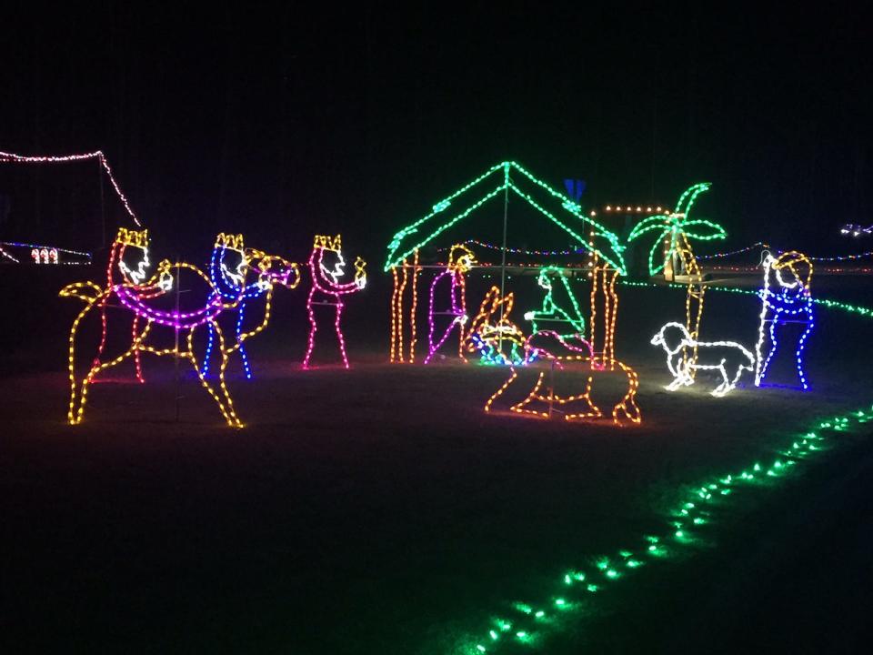 An illuminated nativity is one of several displays on the Holiday Lights drive-thru at Veterans Park in Canton, GA.
