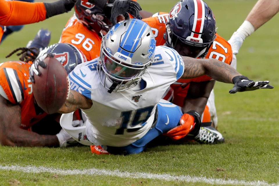 Detroit Lions wide receiver Kenny Golladay (19) dives in for a touchdown against the Denver Broncos during the second half of an NFL football game, Sunday, Dec. 22, 2019, in Denver. (AP Photo/David Zalubowski)