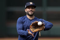 Houston Astros second baseman Jose Altuve warms up during batting practice Monday, Oct. 25, 2021, in Houston, in preparation for Game 1 of baseball's World Series tomorrow between the Houston Astros and the Boston Red Sox. (AP Photo/David J. Phillip)
