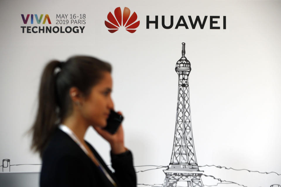 PARIS, FRANCE - MAY 17: A visitor phones in front of the Huawei Technologies Co. logo during the 4th edition of the Viva Technology show at Parc des Expositions Porte de Versailles on May 17, 2019 in Paris, France. Viva Technology, the new international event brings together 9000 startups with top investors, companies to grow businesses and all players in the digital transformation who shape the future of the internet. (Photo by Chesnot/Getty Images)