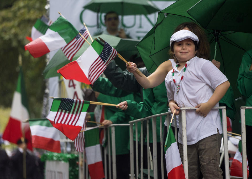 <p>Participants ride a float along a rain-soaked Fifth Ave. during the annual Columbus Day Parade in New York, Monday, Oct. 9, 2017. (Photo: Craig Ruttle/AP) </p>