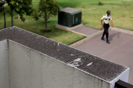 The top of a wall is seen covered with ash after Guatemala's Fuego volcano erupted violently, in Guatemala City, Guatemala June 3, 2018. REUTERS/ Luis Echeverria