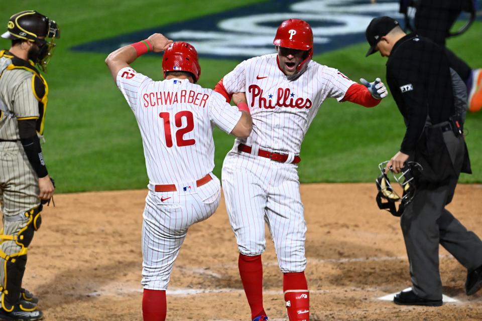 Game 4: Rhys Hoskins celebrates his home run in the fifth inning with Kyle Schwarber.