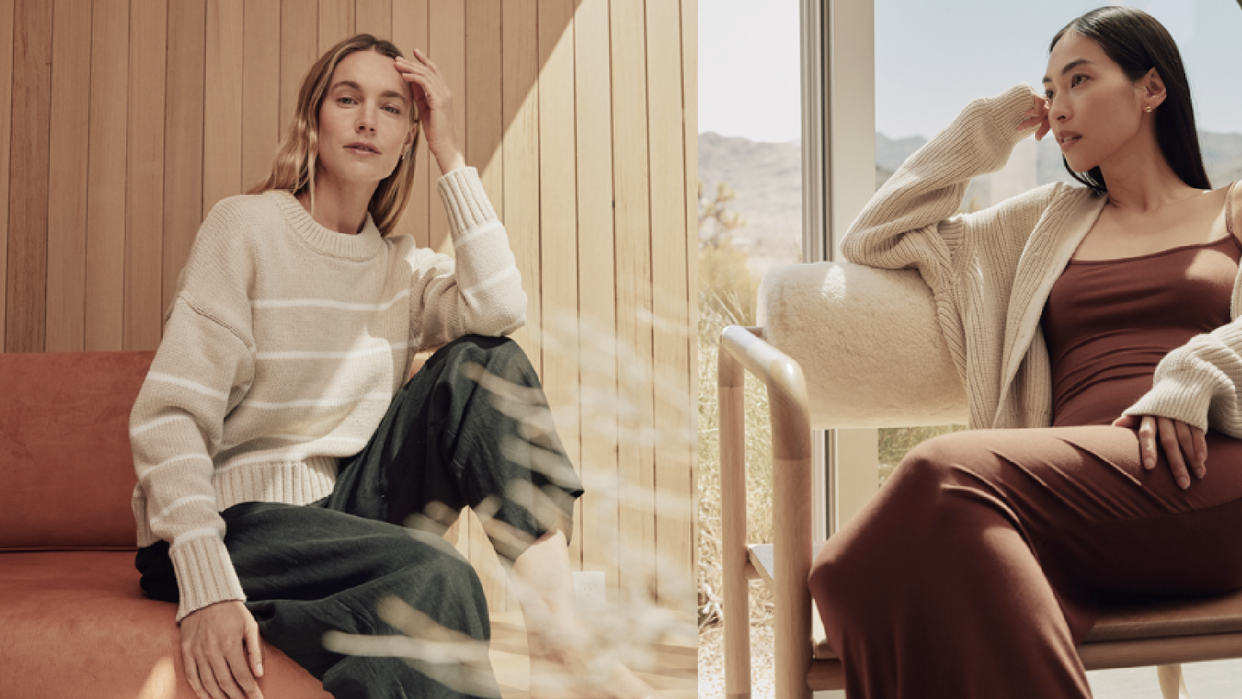 a couple of women sitting on a couch