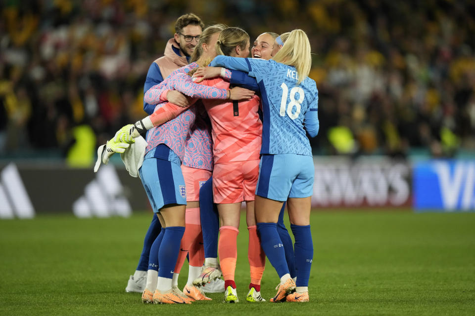 Members of team England celebrate after their win in the Women's World Cup semifinal soccer match against Australia at Stadium Australia in Sydney, Australia, Wednesday, Aug. 16, 2023. (AP Photo/Rick Rycroft)