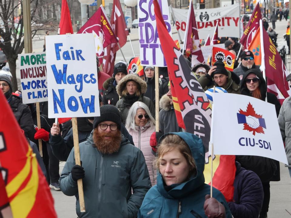 Members of the Public Service Alliance of Canada (PSAC) demonstrate outside the Treasury Board building in Ottawa on Friday, March 31, 2023.