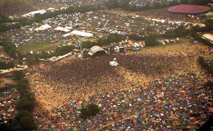 Aerial view of Glastonbury in 1995 (PA)