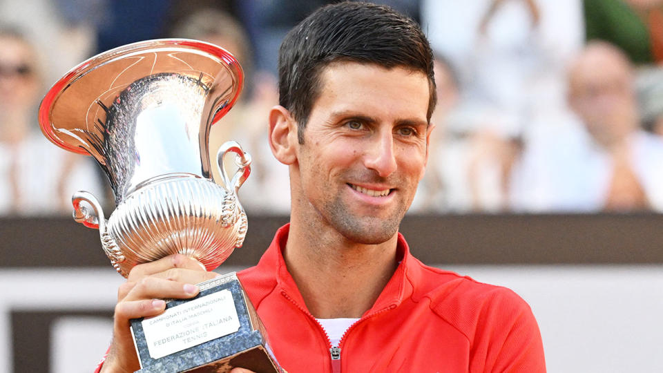 Pictured here, Novak Djokovic holds the trophy after winning a sixth Italian Open title.