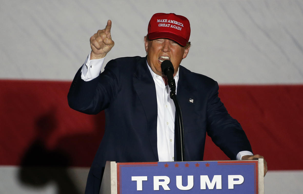 Donald Trump wears a ‘Make America Great Again’ cap at a campaign rally in March 2016 (Getty Images)