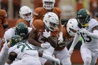 Texas running back Bijan Robinson (5) runs against Baylor during the second half of an NCAA college football game in Austin, Texas, Friday, Nov. 25, 2022. (AP Photo/Eric Gay)