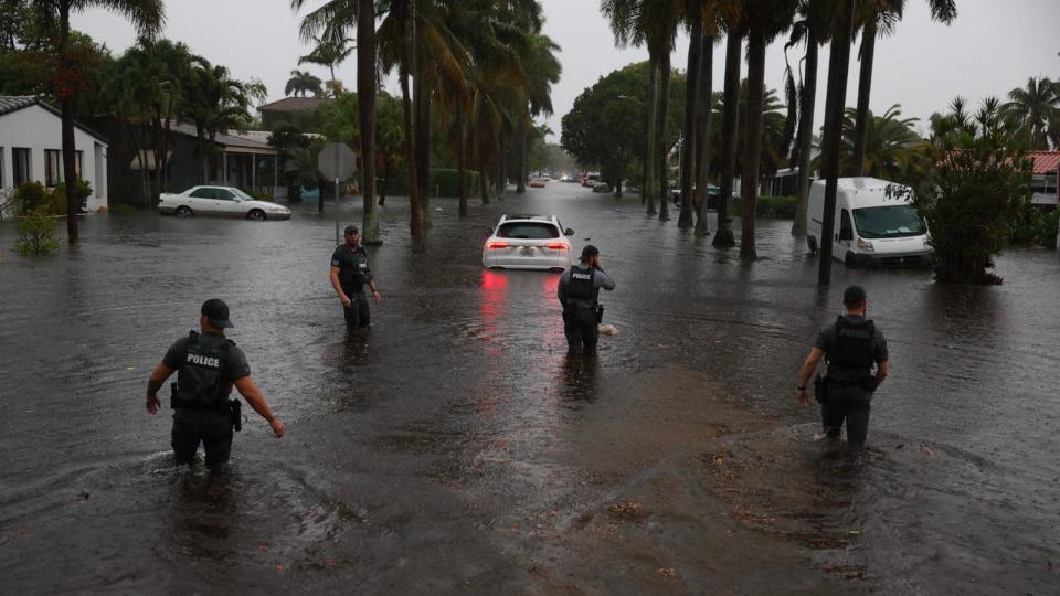 PHOTO: Members of the City of Hollywood SWAT team look for people who may need help being evacuated from a flooded area, June 12, 2024, in Hollywood, Fla. (Joe Raedle/Getty Images)