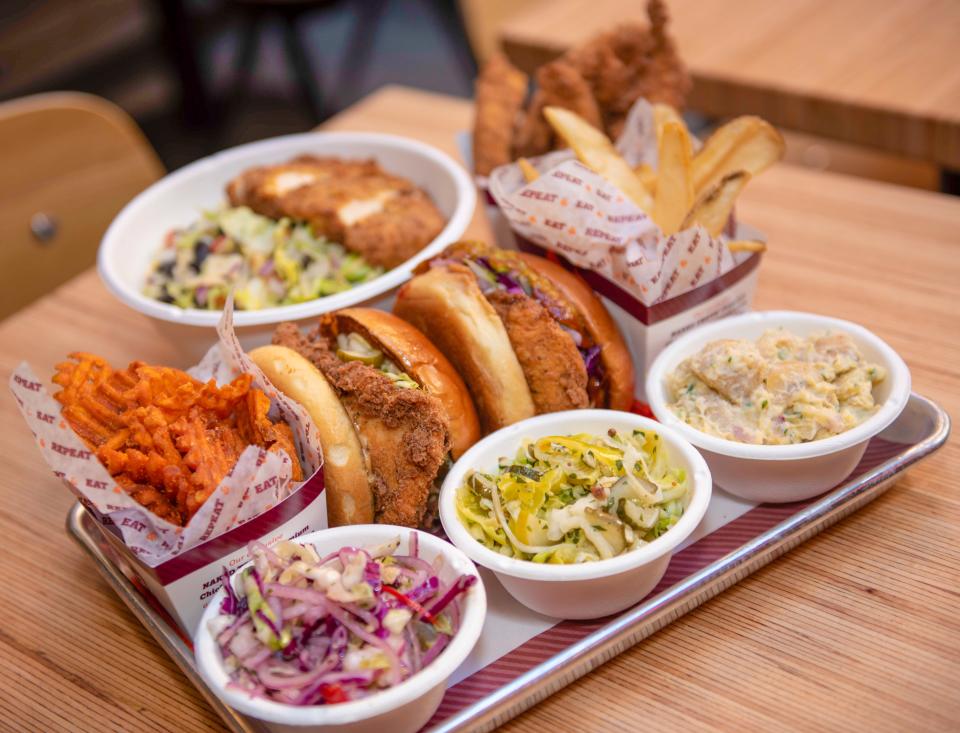 The menu at Big Chicken features a variety of chicken sandwiches with toppings, including mac and cheese and crispy onions, plus sides and desserts.