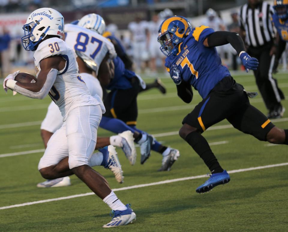 Angelo State University's K'Hari Watson, 7, tries to chase down Texas A&M-Kingsville running back Toneil Carter during a Lone Star Conference football game at 1st Community Credit Union Field at LeGrand Stadium on Saturday, Oct. 22, 2022.