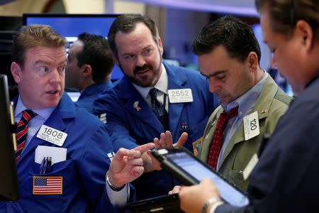 A trader works on the floor of the New York Stock Exchange (NYSE) in New York, U.S., March 1, 2017. REUTERS/Brendan McDermid