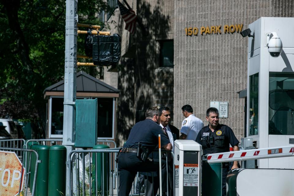 Police officers walk outside Metropolitan Correctional Center jail following Epstein's death on August 10 (REUTERS)