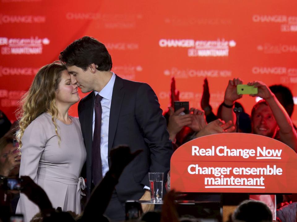 Justin Trudeau shares a moment with Sophie Gregoire Trudeau as he gives his victory speech after Canada's federal election in Montreal, Quebec, October 19, 2015.