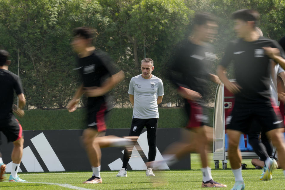 South Korea's head coach Paulo Bento looks at the players during the South Korea's official training on the eve of the group H World Cup soccer match between South Korea and Portugal, at the Al Egla Training Site 5 in Doha, Qatar, Thursday, Dec. 1, 2022. (AP Photo/Lee Jin-man)