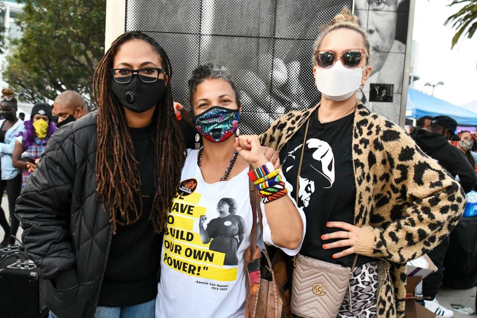 <p>Ava DuVernay poses with Black Lives Matter L.A. co-founder Melina Abdullah and Victoria Mahoney at an Election Day Marathon Party at the Polls, hosted by BLM L.A., at Staples Center on Tuesday.</p>