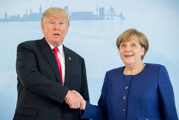 German Chancellor Angela Merkel (R) and US President Donald Trump  shake hands prior to a bilateral meeting on the eve of the G20 summit in Hamburg, northern Germany, on July 6, 2017. Leaders of the world's top economies will gather from July 7 to 8, 2017 in Germany for likely the stormiest G20 summit in years, with disagreements ranging from wars to climate change and global trade. / AFP PHOTO / POOL / Michael Kappeler        (Photo credit should read MICHAEL KAPPELER/AFP/Getty Images)