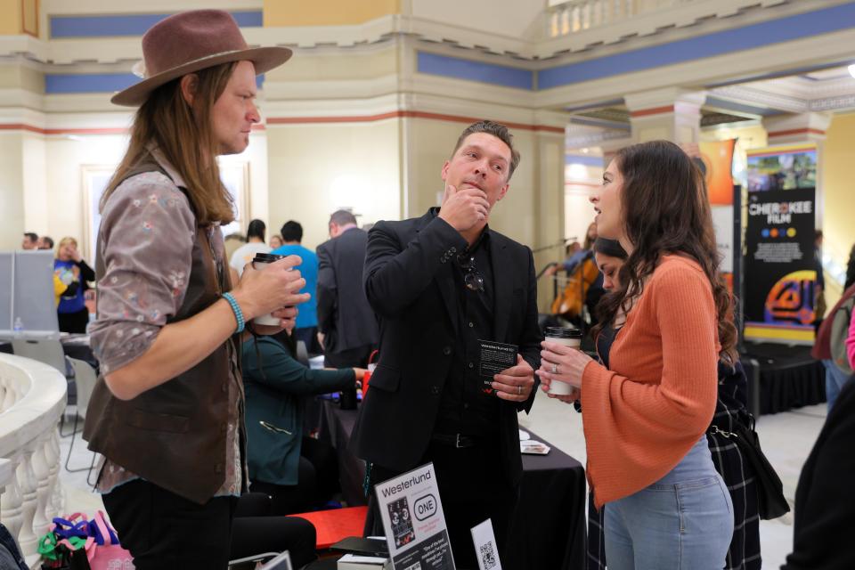 The Imaginaries, husband and wife Maggie McClure and Shane Henry, speak with Isaac Hanson of the band Hanson during Film and Music Day in March at the state Capitol in Oklahoma City.