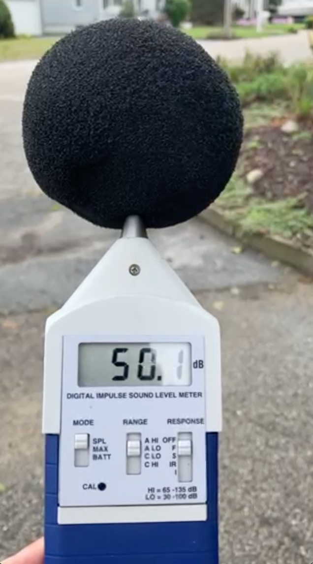 Cranston police use a sound meter to measure noise near a gun range.