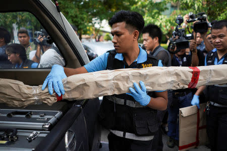 A Thai forensic expert puts an evidence as they leaves from a site of bomb blast at the Phramongkutklao Hospital, in Bangkok, Thailand, May 22, 2017. REUTERS/Athit Perawongmetha