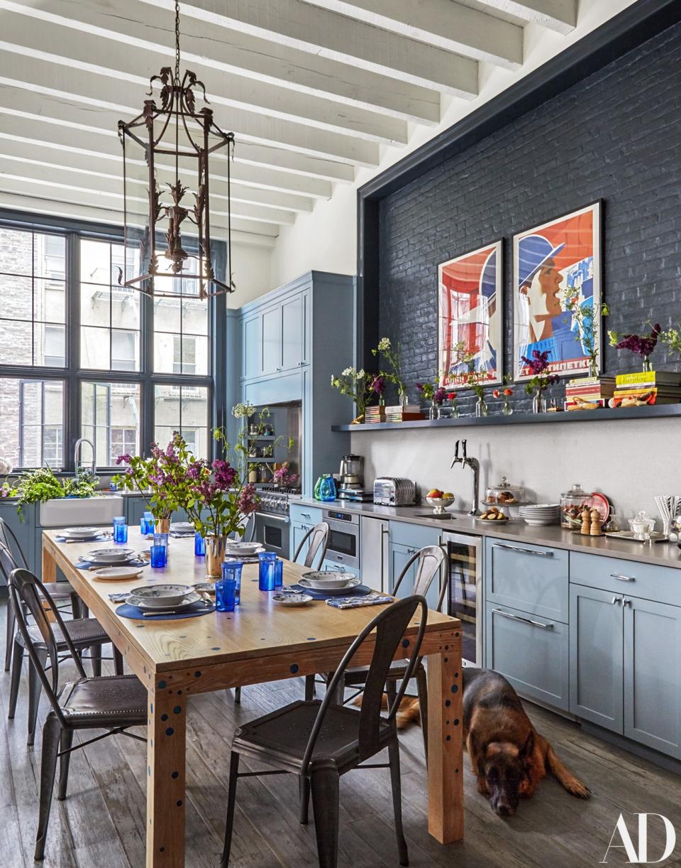 A vintage lantern crowns the kitchen; custom table by Foundrywood.