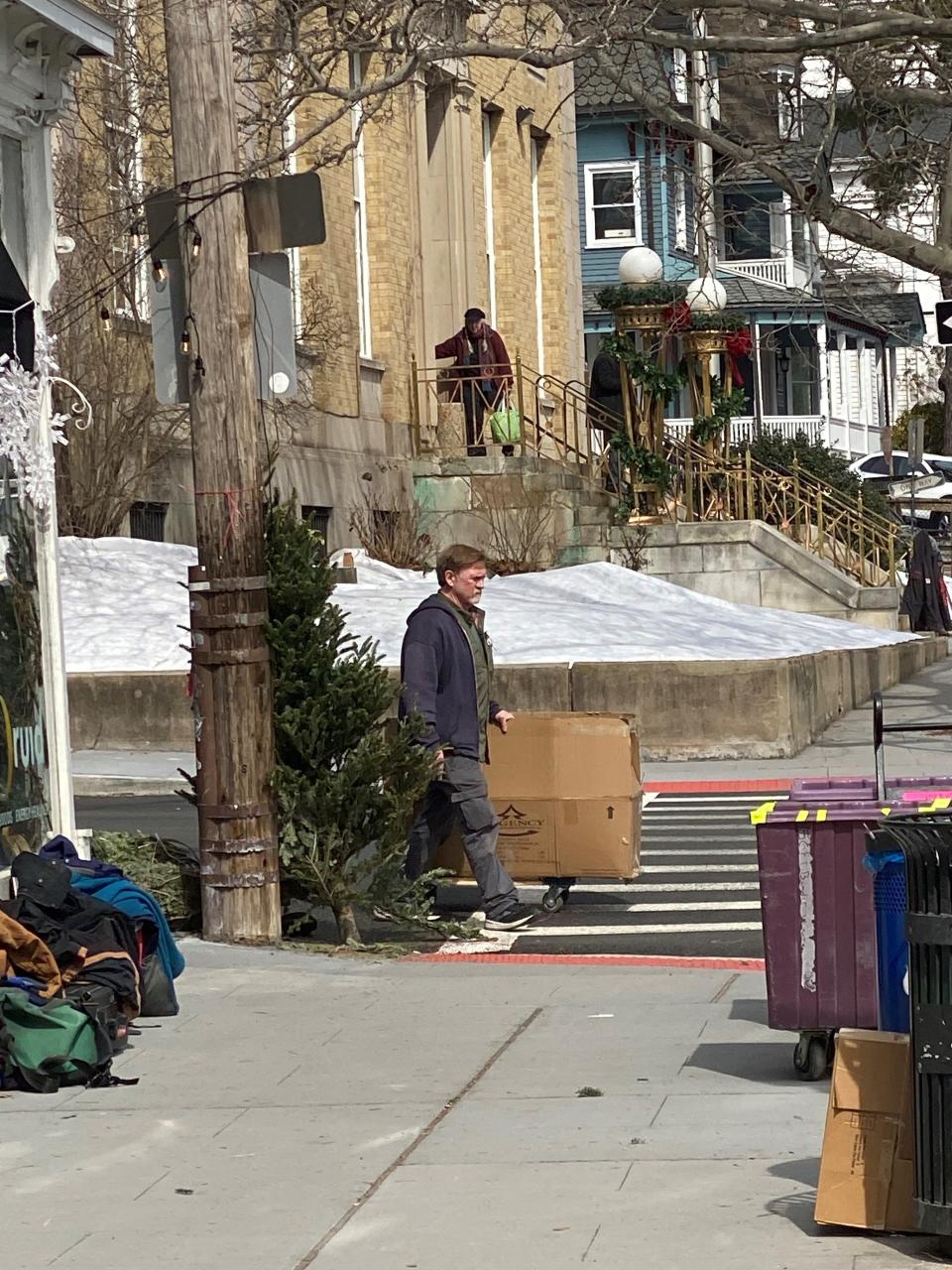 Film crew setting up fake snow in Nyack for the holiday movie 'Bernard and the Genie' being shot March 20, 2023.