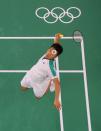 <p>Taiwan's Lee Yang hits a shot next to Taiwan's Wang Chi-lin in their men's doubles badminton final match against China's Li Junhui and China's Liu Yuchen during the Tokyo 2020 Olympic Games at the Musashino Forest Sports Plaza in Tokyo on July 31, 2021. (Photo by LINTAO ZHANG / POOL / AFP) (Photo by LINTAO ZHANG/POOL/AFP via Getty Images)</p> 