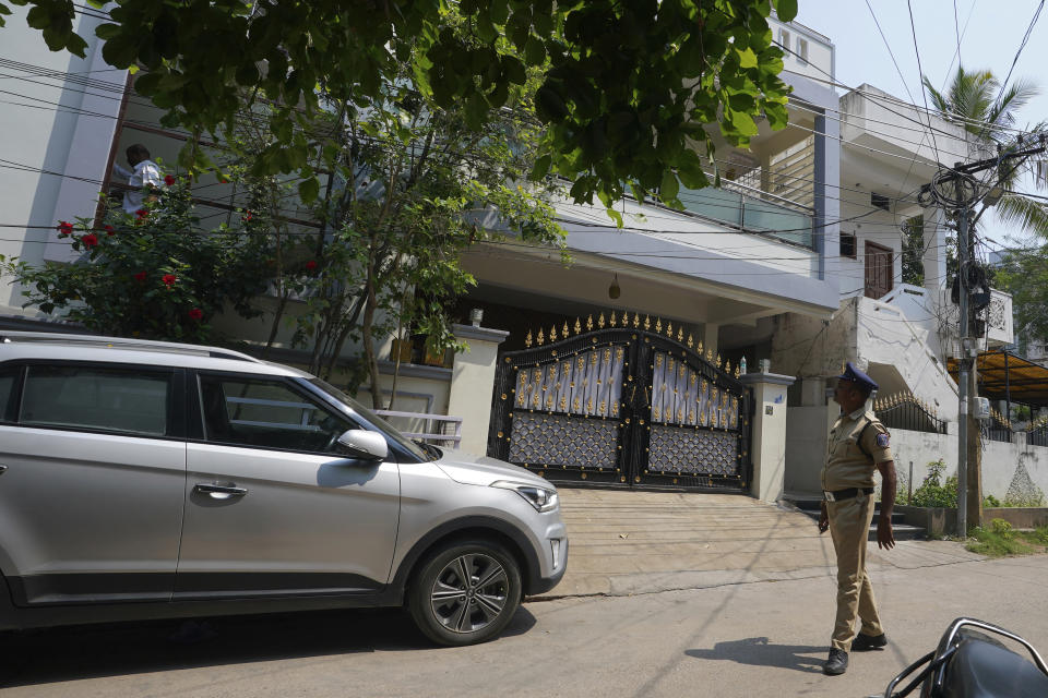 A policeman walks past the residence of Aishwarya Thatikonda's parents in Hyderabad, India, Tuesday, May 9, 2023. Thatikonda, 26, a civil engineer from India, was among eight people killed when a gunman opened fire at Dallas-area outlet mall on Saturday. (AP Photo/Mahesh Kumar A.)