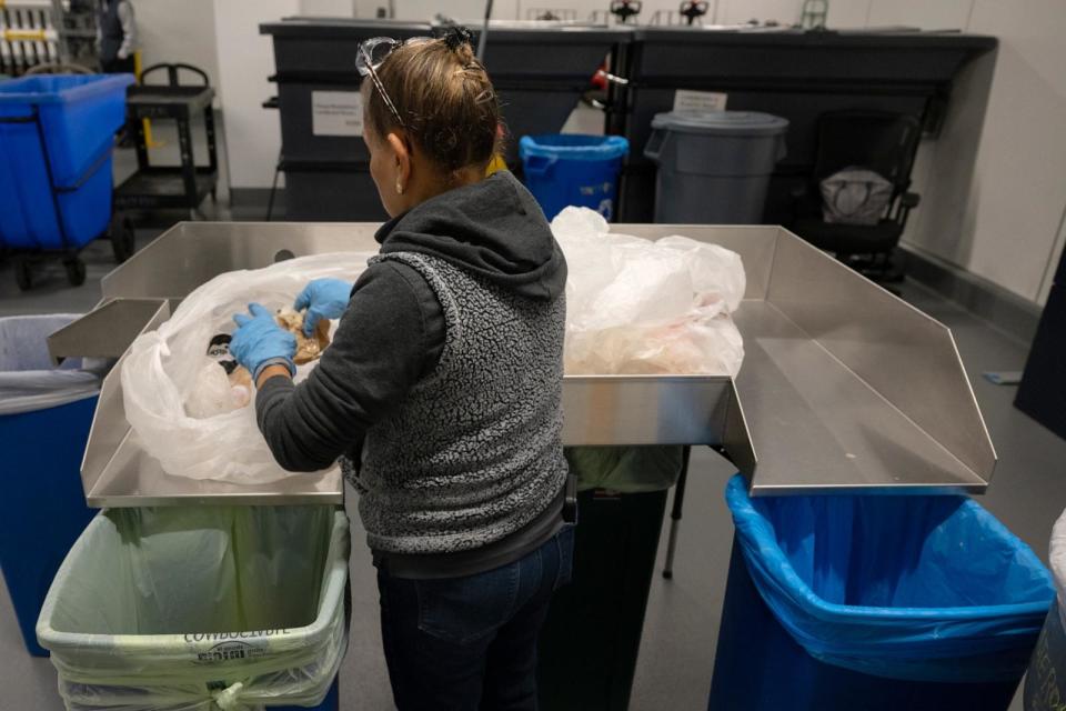 PHOTO: Workers sort through trash for food and compostable items at the Google Bay View campus in Mountain View, California, Nov. 28, 2023. (Mike Kai Chen/Bloomberg via Getty Images)