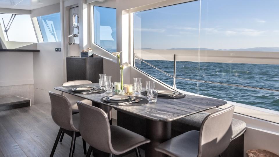 The boat has a minimalist interior, surrounded by large panes of glass. - Credit: Courtesy Numarine