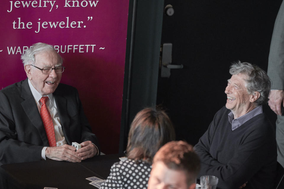 Warren Buffett, Chairman and CEO of Berkshire Hathaway, left, jokes with Gill Gates, right, during a game of bridge following the annual Berkshire Hathaway shareholders meeting in Omaha, Neb., Sunday, May 5, 2019. (AP Photo/Nati Harnik)