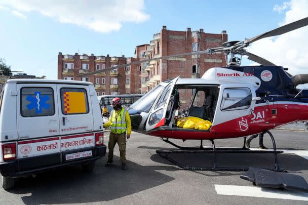 PHOTO: A helicopter carrying the body of famed U.S. extreme skier, Hilaree Nelson, lands at a hospital in Kathmandu, Nepal, Sept. 28, 2022. Nelson, 49, was skiing down from the summit of Mount Manaslu when she fell off the mountain. (Niranjan Shrestha/AP)