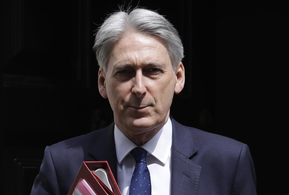 Britain's Chancellor Philip Hammond leaves 11 Downing Street to attend the weekly session of Prime Ministers Questions in Parliament in London, Wednesday, May 22, 2019. (AP Photo/Kirsty Wigglesworth)