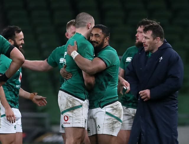 Jacob Stockdale, centre left, and Bundee Aki celebrate Ireland's win