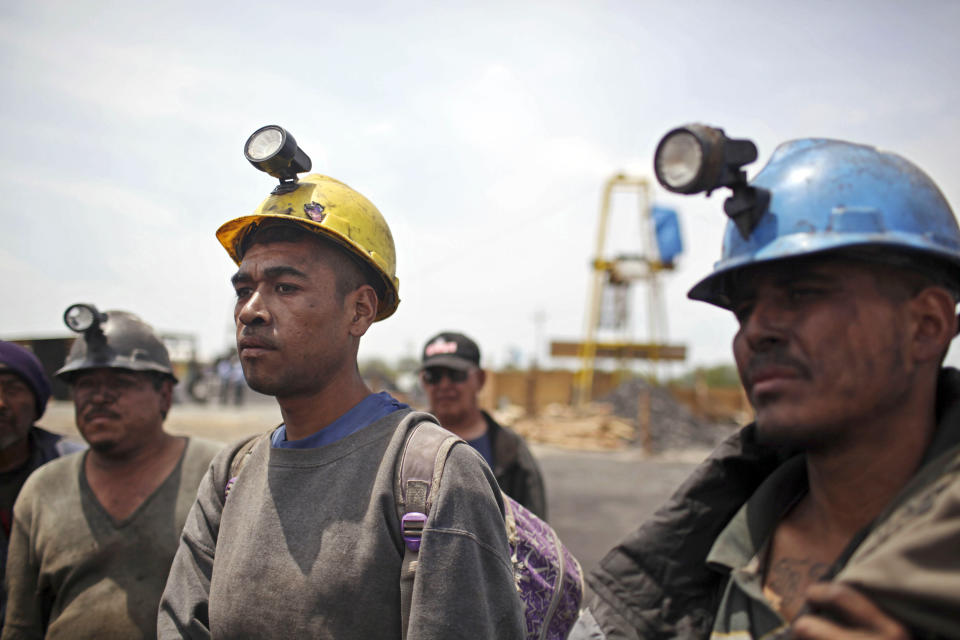 FILE - Miners helping in the rescue operation of fellow trapped miners are interviewed in San Juan de Sabinas, Coahuila state, Mexico, May 4, 2011. The administration of Mexican President Andres Manuel Lopez Obrador has resuscitated a form of coal mining so dangerous and primitive that both houses of Mexico’s Congress tried to ban it in 2012. (AP Photo/Alexandre Meneghini, File)