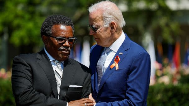 PHOTO: President Joe Biden embraces Garnell Whitfield Jr., the son of Ruth Whitfield who was killed in a mass shooting in Buffalo, NY, at an event on the South Lawn of the White House, July 11, 2022, in Washington. (Chip Somodevilla/Getty Images)