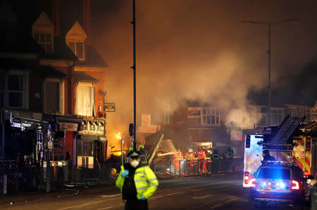 Members of the emergency services work at the site of an explosion which destroyed a convenience store and a home in Leicester, Britain, February 25, 2018. REUTERS/Darren Staples