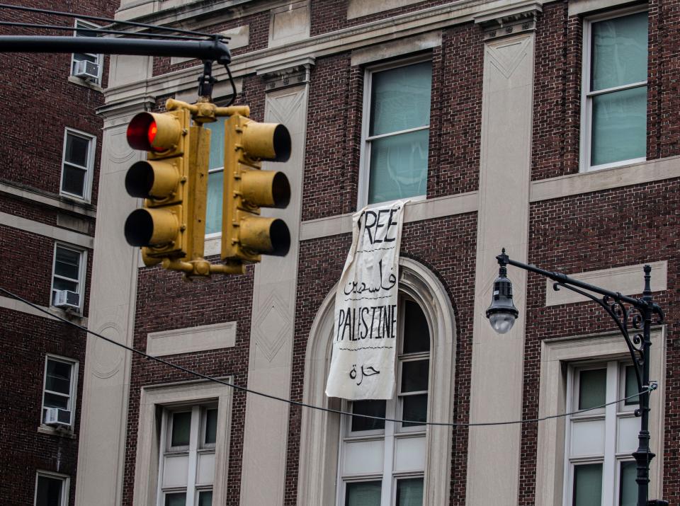 A sign hangs from Hamilton Hall on April 30 at Columbia University after student protesters took over the building. The protesters occupied the building after the university began suspending student protesters and refused to divest from companies that have business interests with Israel.