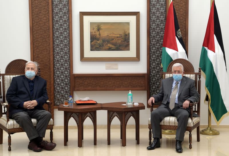 Palestinian President Mahmoud Abbas meets with Chairman of the Palestinian Central Election Committee Hana Naser in Ramallah in the Israeli-occupied West Bank