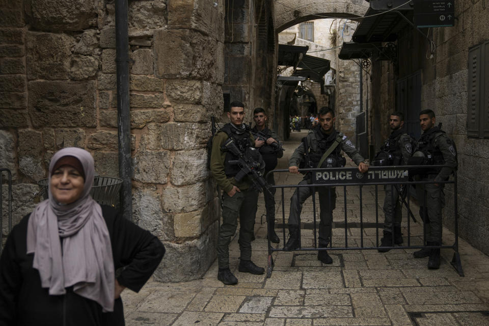 Israeli border police officers close an alley following a stabbing attack in Jerusalem's Old City, Thursday, Nov. 3, 2022. A Palestinian stabbed a police officer in Jerusalem's Old City, police said, and officers opened fire on the attacker, killing him. The officer was lightly wounded. (AP Photo/Mahmoud Illean)