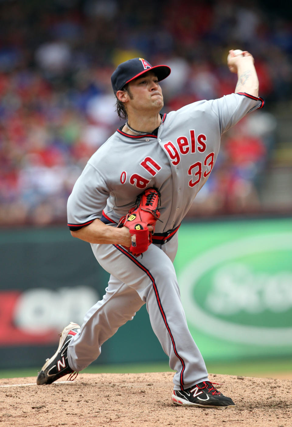 ARLINGTON, TX - MAY 12: C.J. Wilson #33 of the Los Angeles Angels of Anaheim pitches against the Texas Rangers on May 12, 2012 in Arlington, Texas. The Angels won 4-2. (Photo by Layne Murdoch/Getty Images)