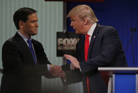 Republican U.S. presidential candidate Senator Marco Rubio (L) shakes hands with rival candidate businessman Donald Trump at the conclusion of the Fox Business Network Republican presidential candidates debate in North Charleston, South Carolina, January 14, 2016. REUTERS/Chris Keane